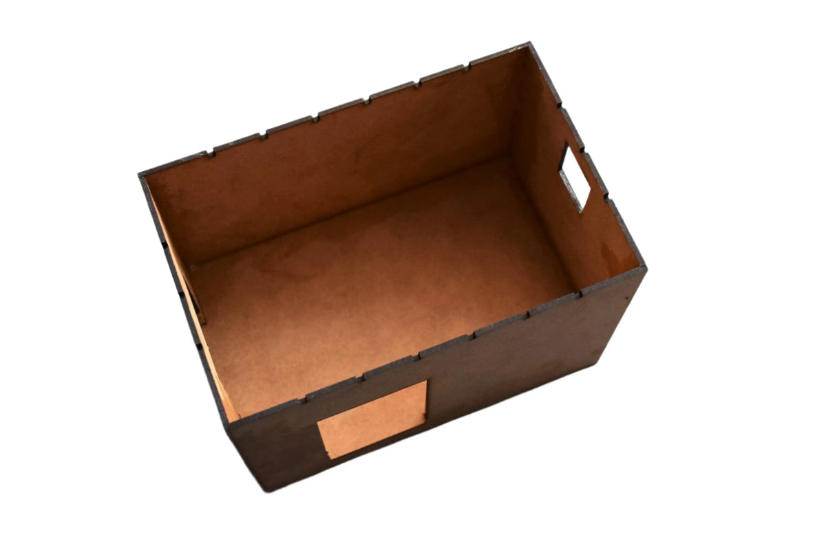 Rail Model Rhoystellen Station Goods Shed, 4 mm scale—view of the bare laser-cut MDF core box with finger-jointed edges and cut-out window openings, illustrating the internal shell before brick cladding is added.
