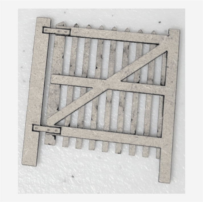 Laser cut MDF gate for model railway or fencing, consisting of vertical and horizontal wooden planks, uncolored.