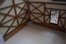 Load image into Gallery viewer, A photo showing a model of a timber built carriage shed, featuring a tiled roof and wooden truss details.