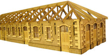 Load image into Gallery viewer, A laser cut and engraved wooden model kit resembling a railway station with detailed architecture.