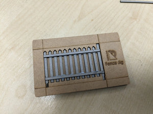 A greyboard fencing kit for model railroads, showing the back runners 