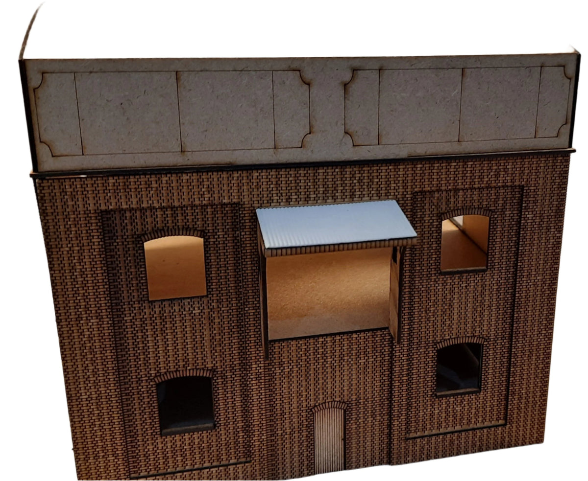 A laser cut and engraved model of a coal stage building, resembling a structure found in the GWR Didcot area, made from layers of brick etched MDF with windows, doors, and stair section included.