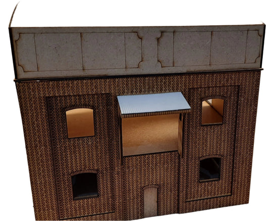 A laser cut and engraved model of a coal stage building, resembling a structure found in the GWR Didcot area, made from layers of brick etched MDF with windows, doors, and stair section included.
