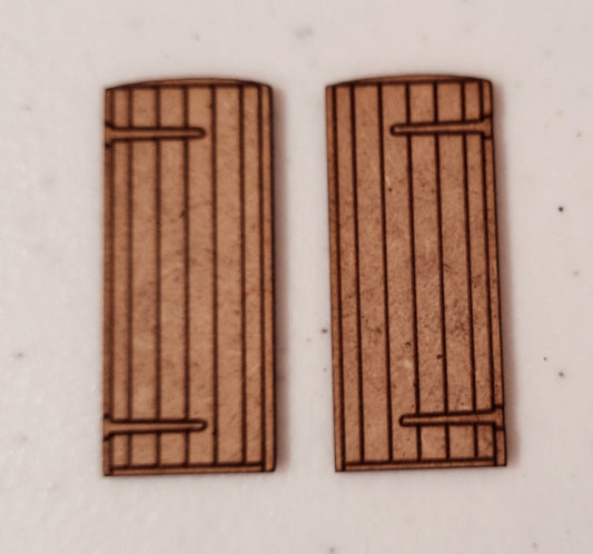 Two wooden panel style doors made from laser cut MDF, displayed on a white background.