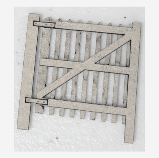 Laser cut MDF gate for model railway or fencing, consisting of vertical and horizontal wooden planks, uncolored.