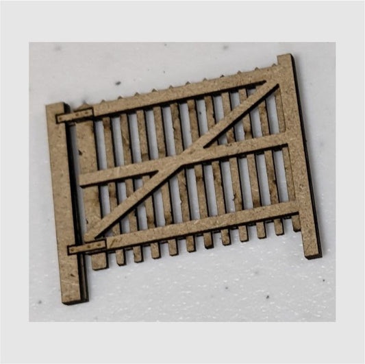 A laser cut MDF gate for model fencing, 7mm wide, with posts, designed for use in model making.