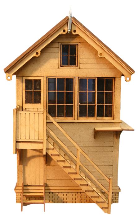 A laser cut and etched wooden signal box kit with detailed windows, stairs, and a overhanging balcony.