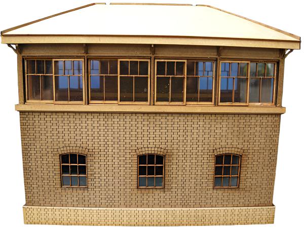 A model of a signal box, with a slanted roof, windows, and a staircase, made with a light-colored material.
