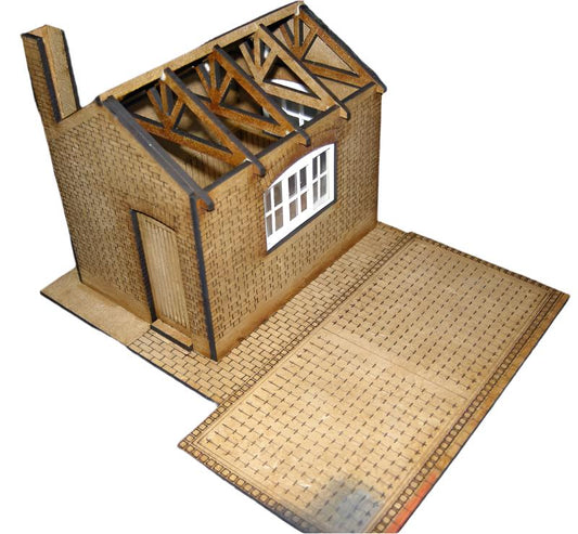 A model of a weighbridge kit made from MDF with window film and gutter, roof tiles, displayed with a 4mm footprint. No glue or paints included.